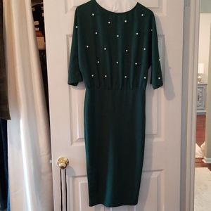 Chic green dress adorned with Pearls at the top